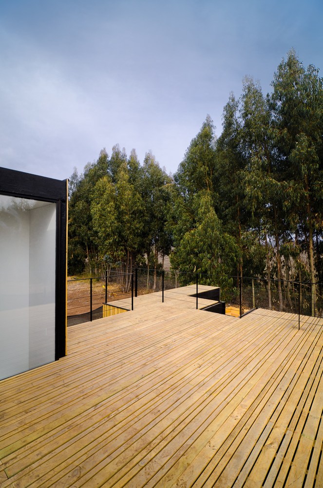 Casa SIP — fachada con revestimiento de madera vertical norte, arquitecto Alejandro Soffia